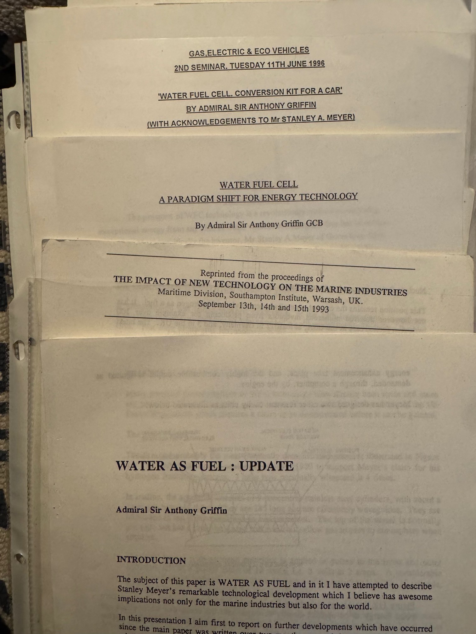 The four Griffin papers found in James Wight's papers, as photographed in September 2026: from the top, the June 1996 seminar paper, "A Paradigm Shift for Energy Technology", the reprint from the 1993 Warsash proceedings, and "Water as Fuel: Update".