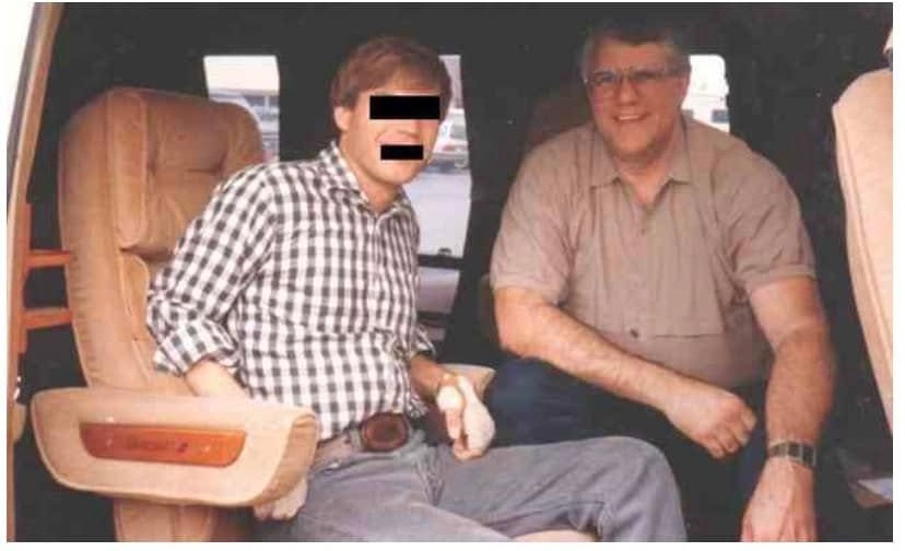 Jim Wight (left) with Stan Meyer in a van on his 1988 visit to the Grove City lab. The copy the archive has is captioned "JW with Stan Meyer on 1988 visit to Grove City Lab", and the bars over his eyes and mouth are in it; the archive has left them as they are.