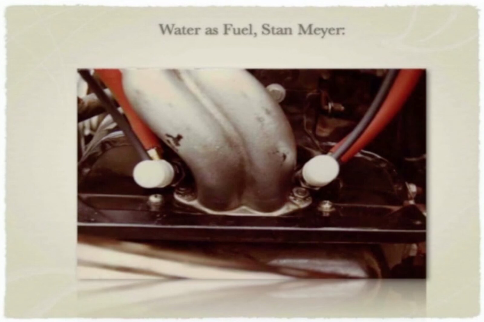 Two water fuel injectors, the white bodies, screwed into the intake manifold of the buggy's engine, with their leads. A close-up from Dahlström's archive.